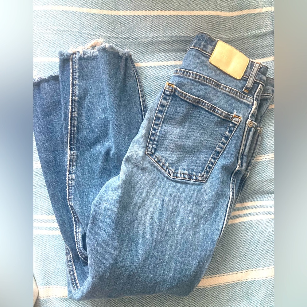 Everlane high rise cheeky bootcut jean in antique blue.